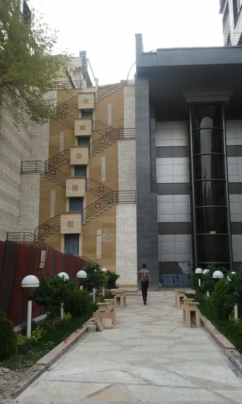 a man standing in front of a building