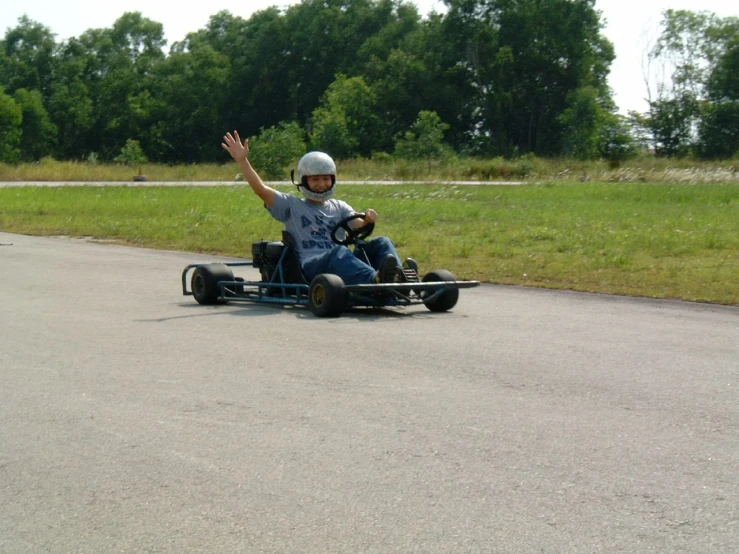 two people riding a bumper to bumper car on the road