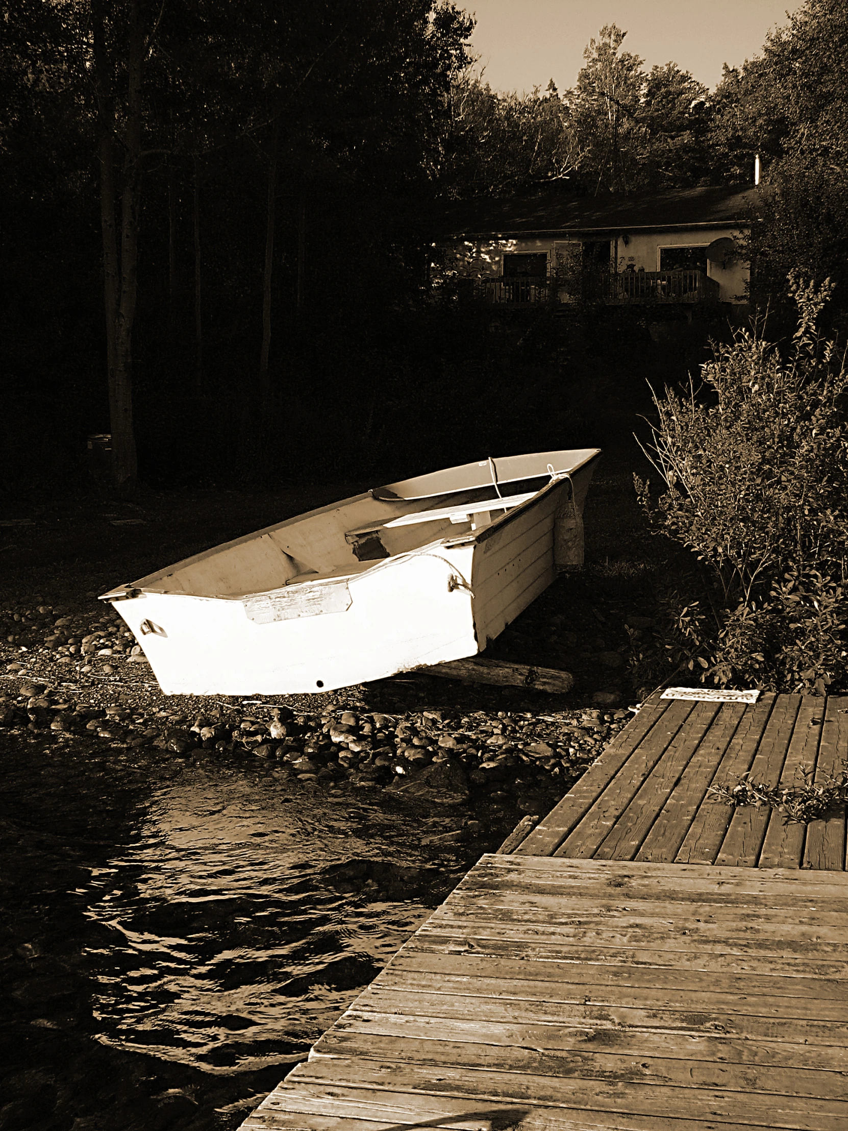 an old wooden boat on a dock and water