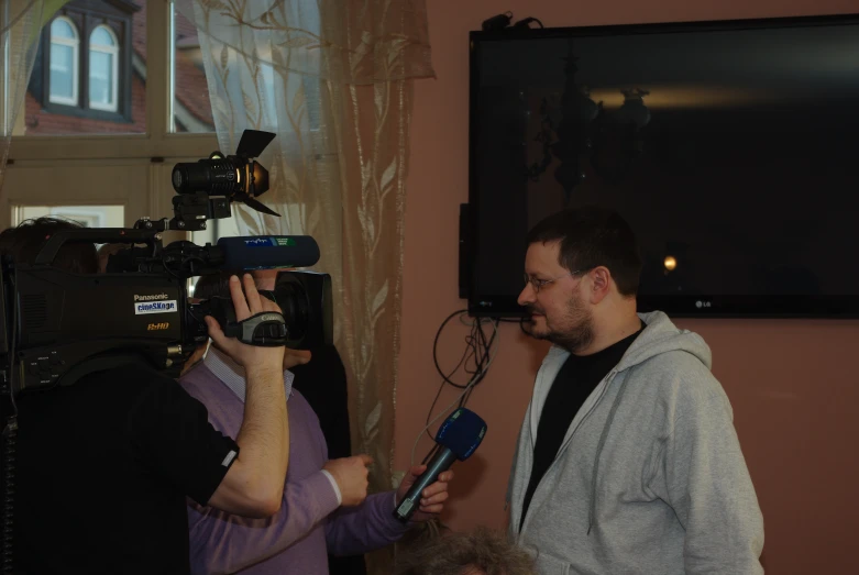 two men in a house standing up together