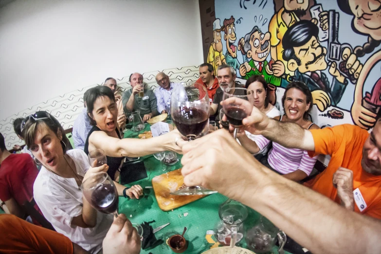 a group of people sitting at a table with wine glasses