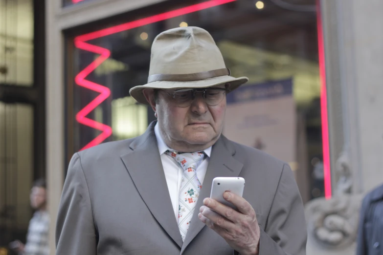 an old man looking at his cell phone