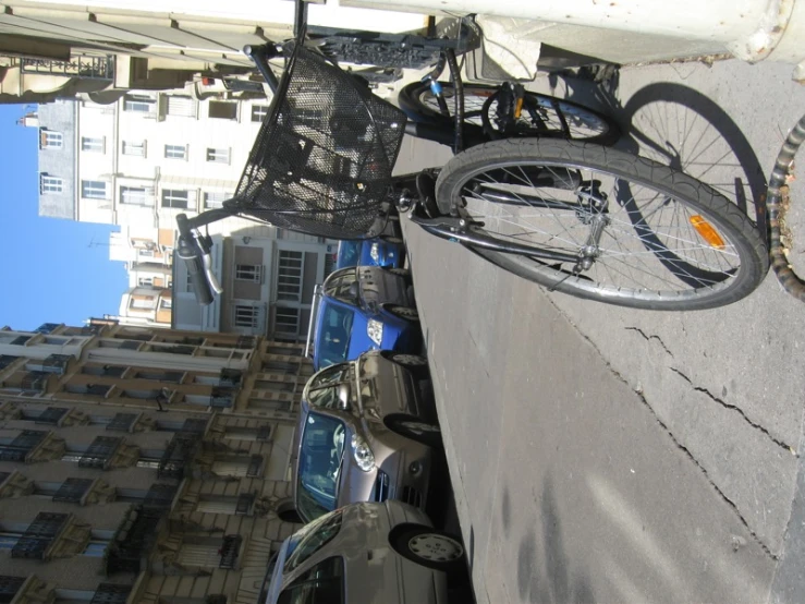 a bicycle parked up against the side of a building