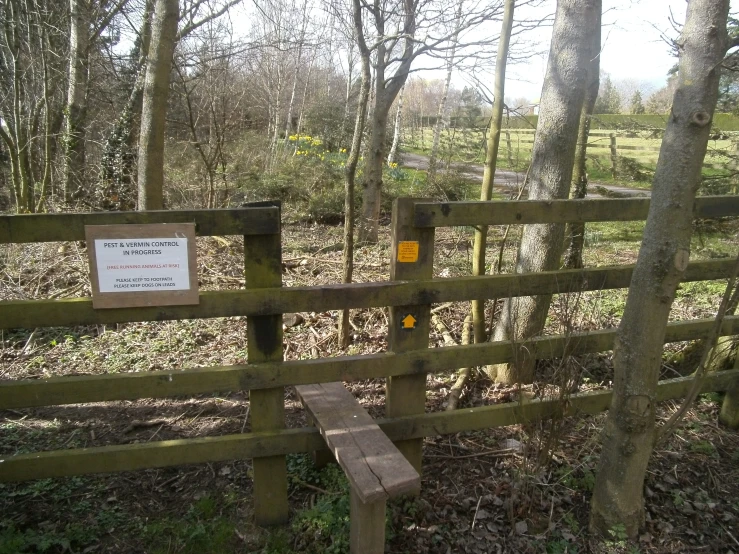 a wooden bench on a walk way