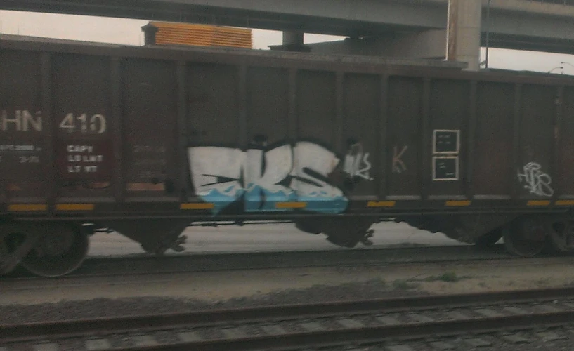 a train car with some grafitti on the side