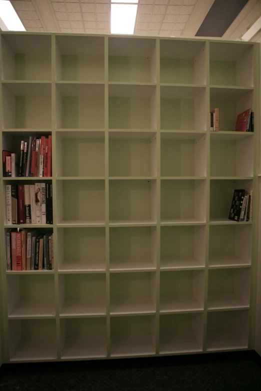 an open bookcase in a liry filled with lots of books