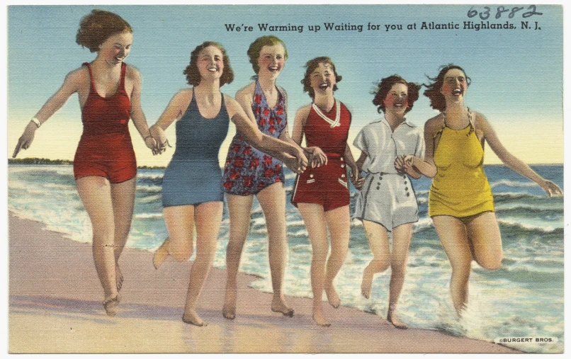 the vintage picture shows four young women walking on the beach