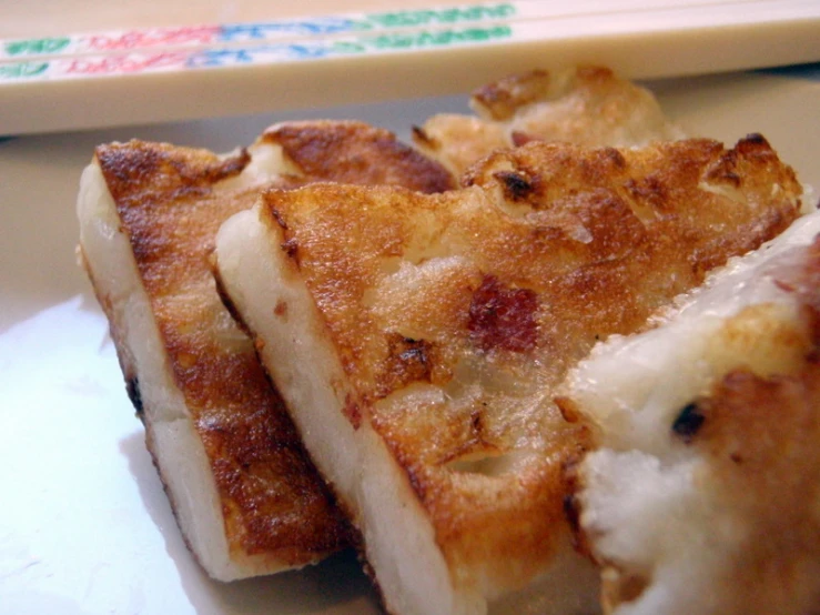 pieces of bread are stacked on a plate