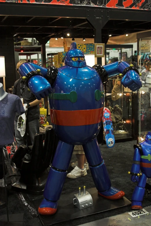 a large robot statue is on display inside