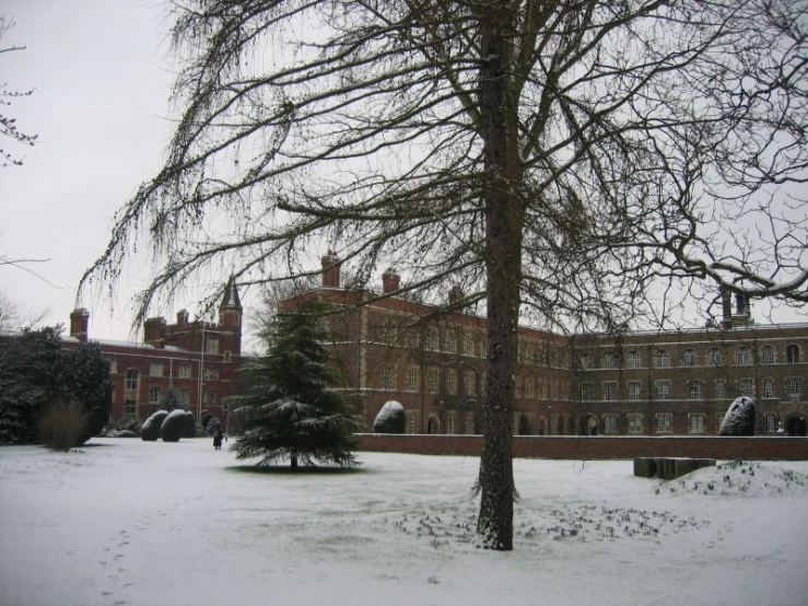 an old building with snow in front