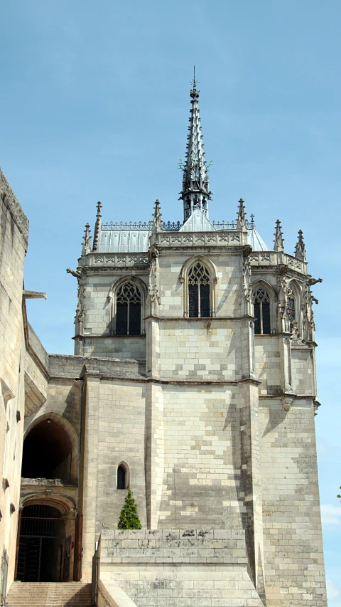 an ancient architecture with a steeple in the background