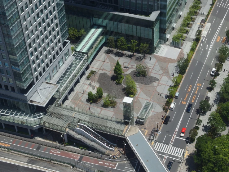 an aerial view of a street and its surrounding buildings