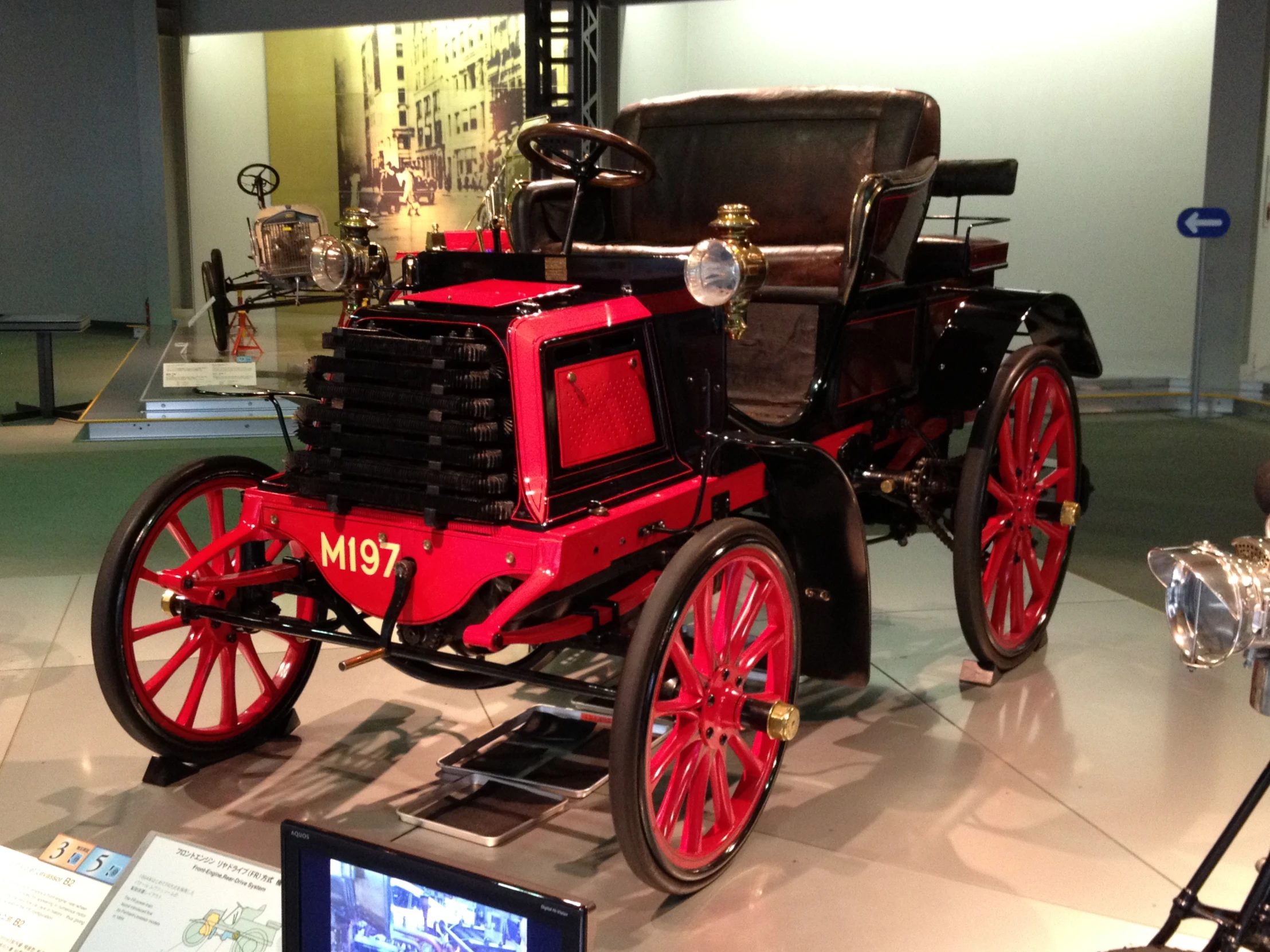 an old fashioned fire engine sitting on display