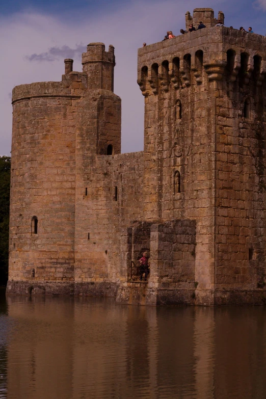 the view of a castle in the water is incredible