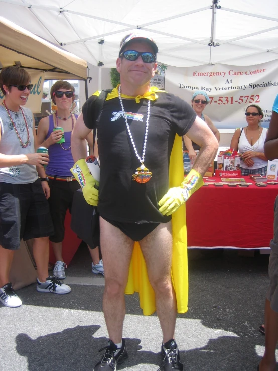 a man in a black shirt and yellow cape