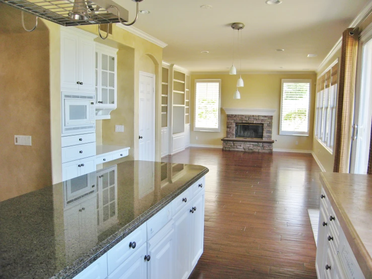 there is a room with cabinets and a fireplace