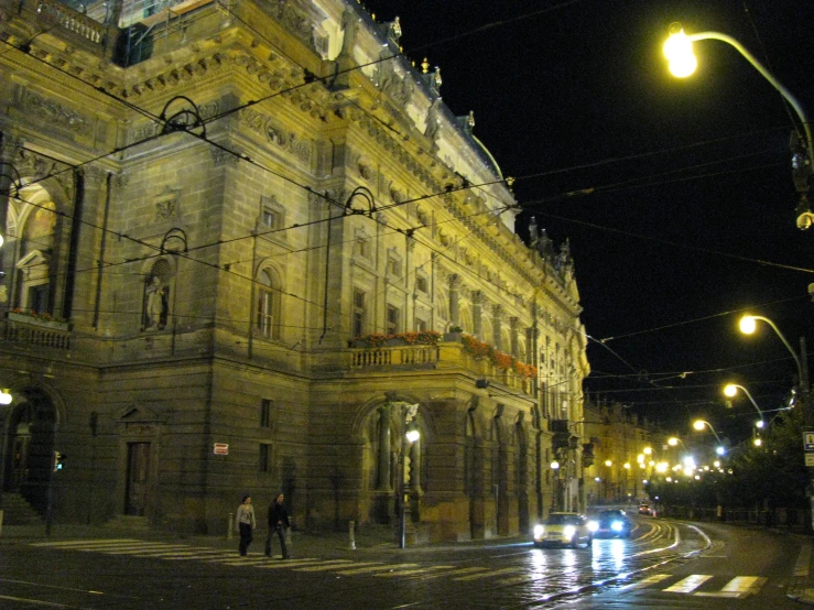 a very big old building by some lights