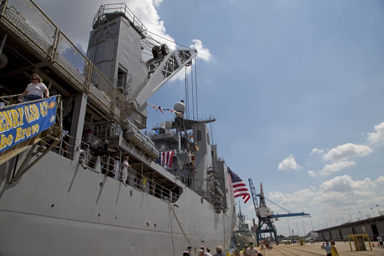 a boat is docked and the american flag flies from it