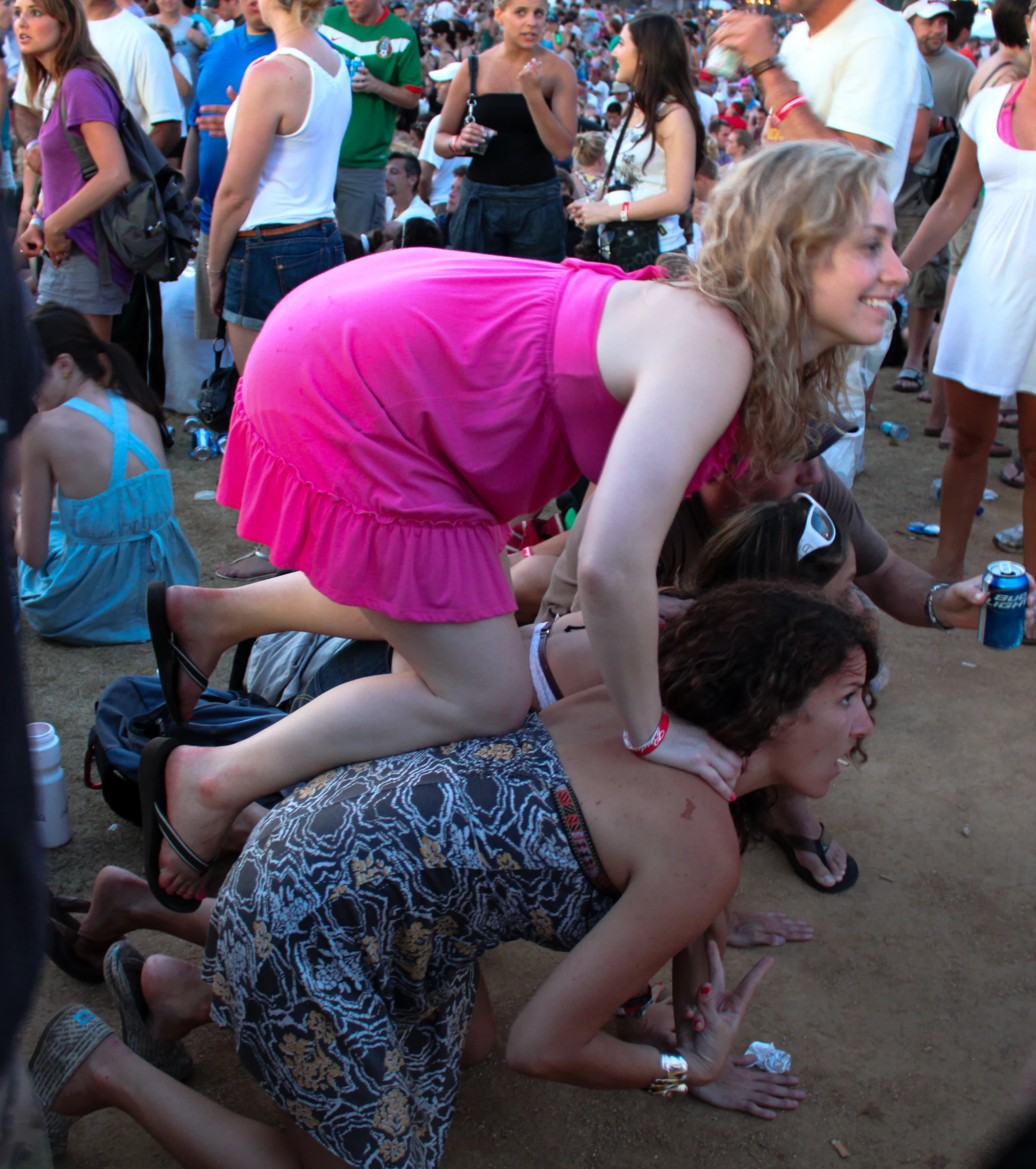 people all around the sand at a music festival