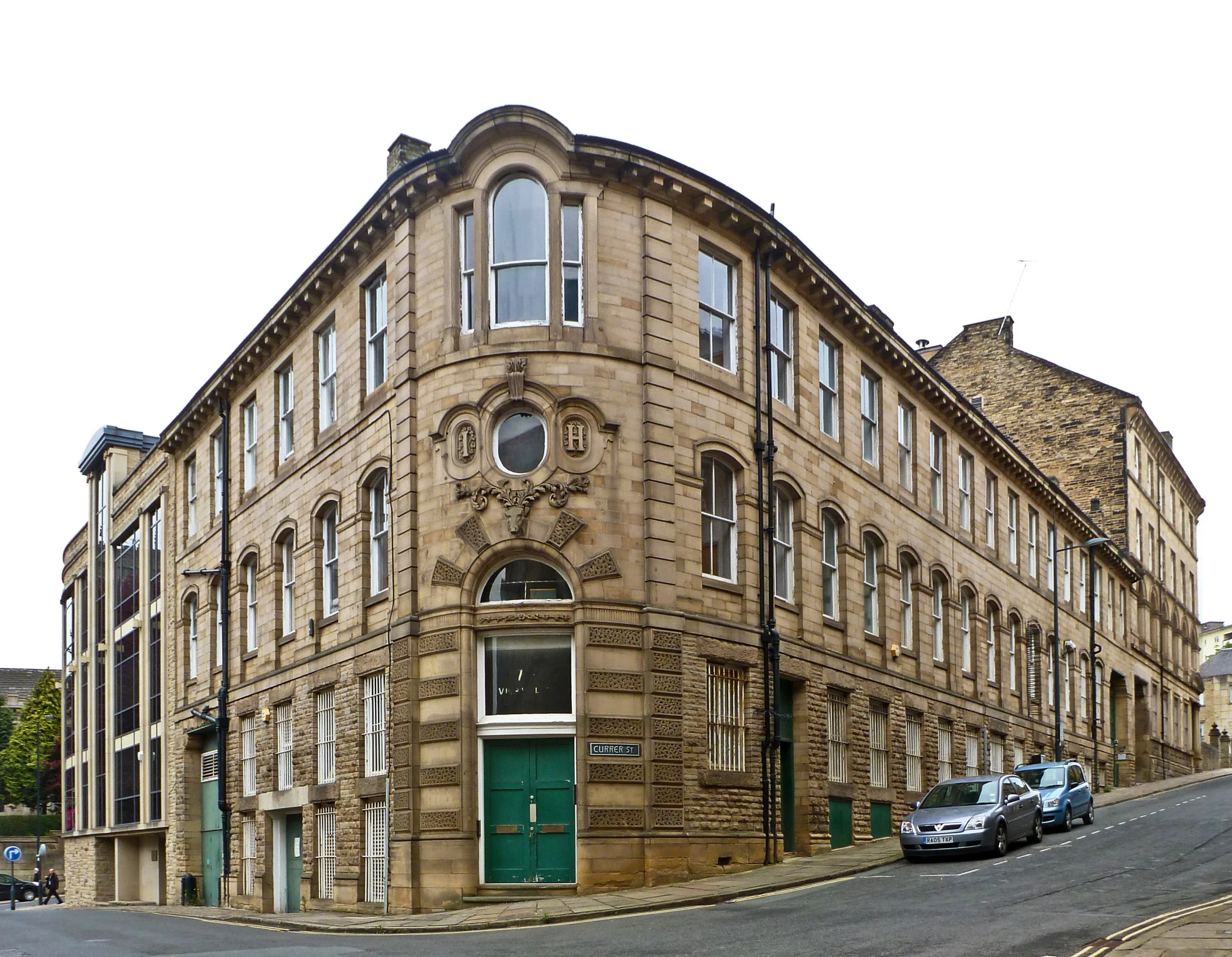 a building is shown with cars parked outside