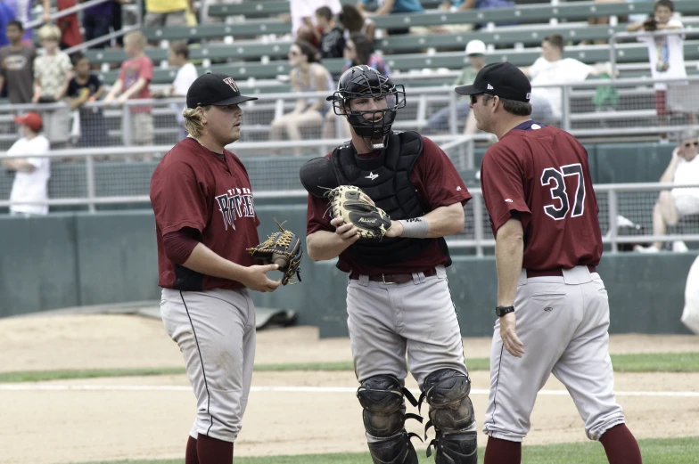 two baseball players are standing on the field