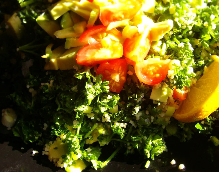 close up of chopped broccoli and sliced tomatoes