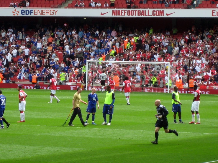 a soccer match is being played on the field