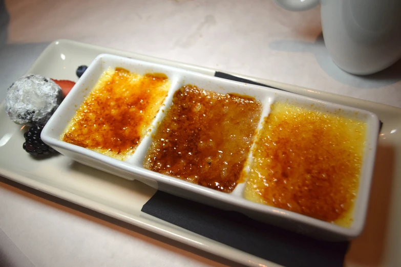 a plate with four different condiments that are on it