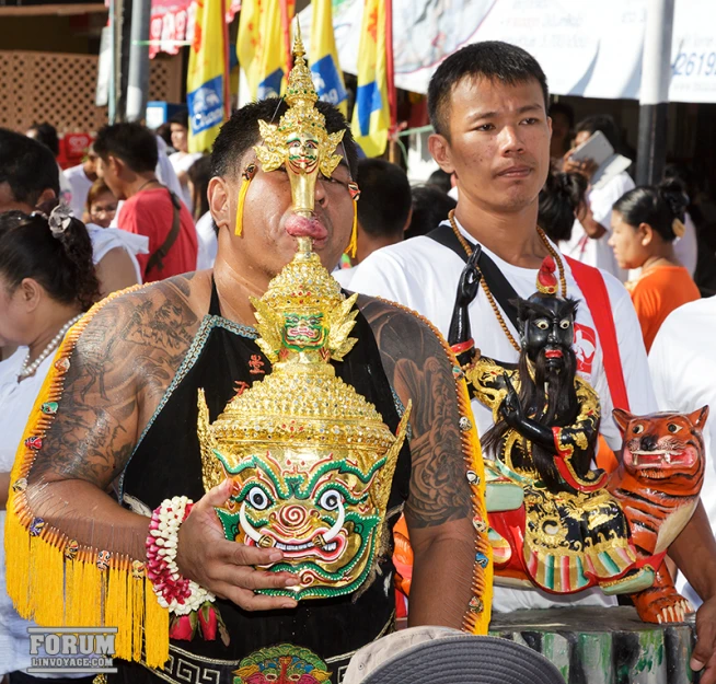 some people with elaborately decorated masks standing together