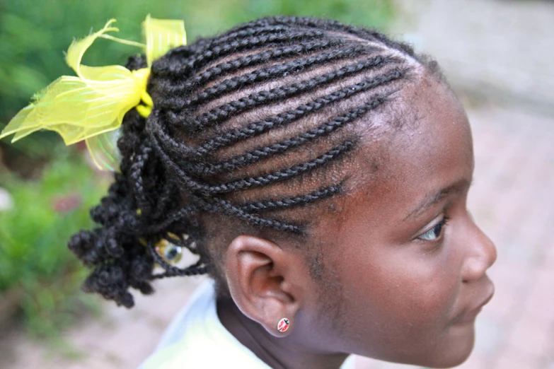 little girl with a ids and a flower in her hair