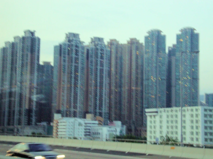 cars on the highway in front of some skyscrs