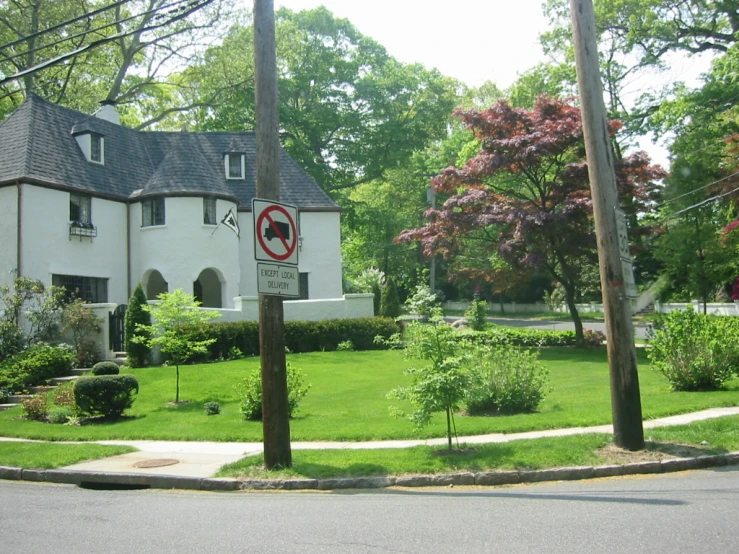 a road that has a very cute building near a street