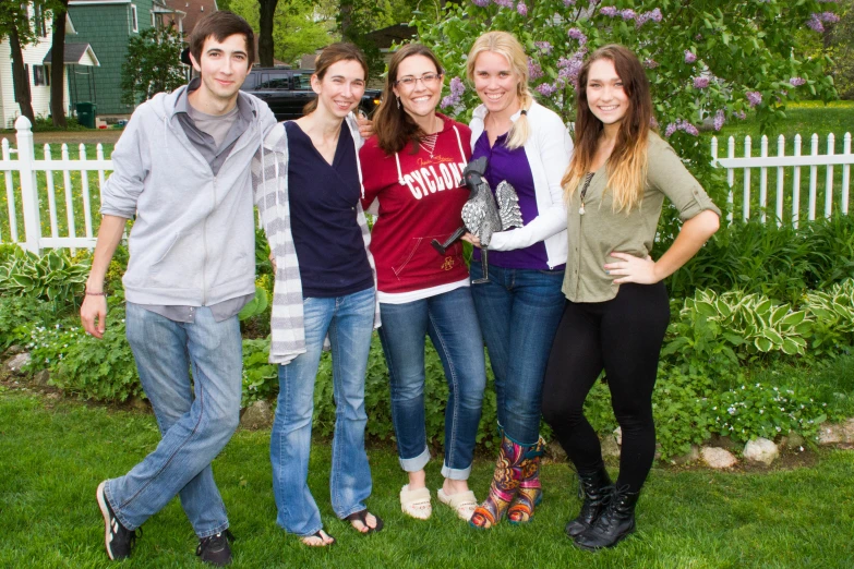 young friends posing in a garden for the camera