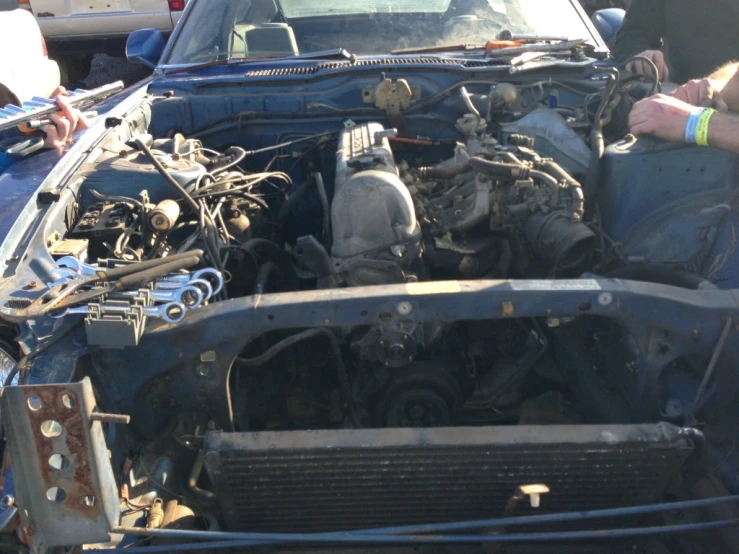 an older car engine showing off the bad ass parts