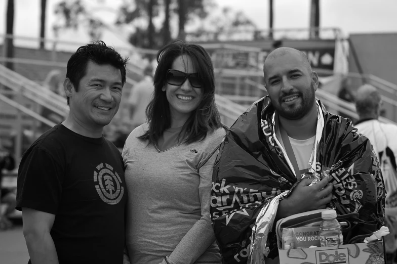 two women and one man posing for a picture