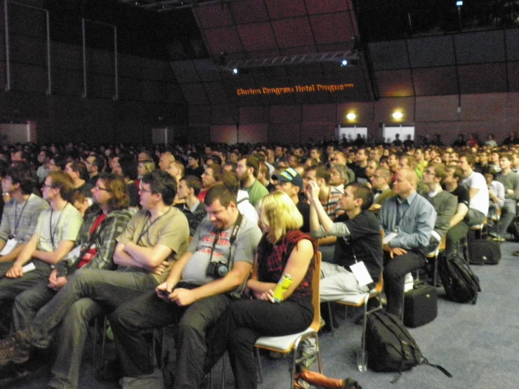 a large group of people in a lecture hall