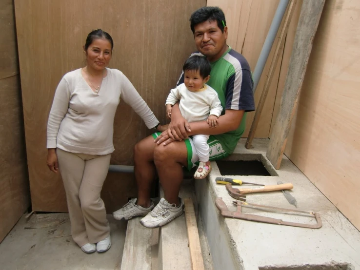 a family posing for a po inside the room