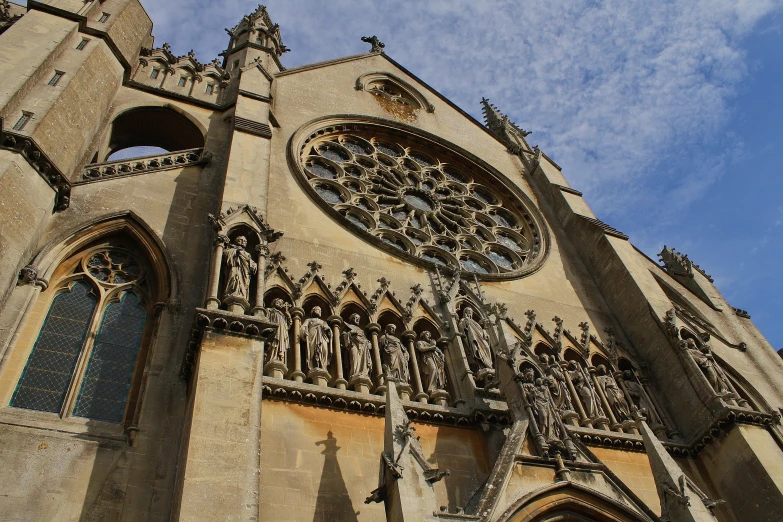 the gothic cathedral has very intricate decorations and a clock