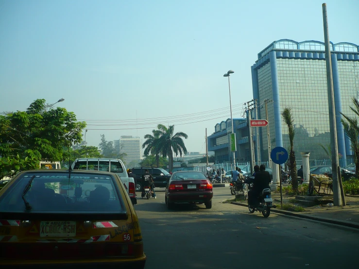 cars are on a city street in a foreign country