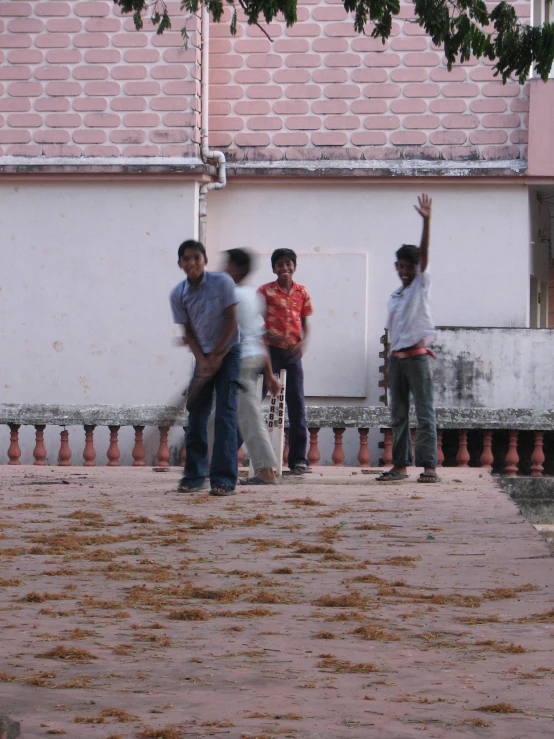 a group of men standing on the side of a road