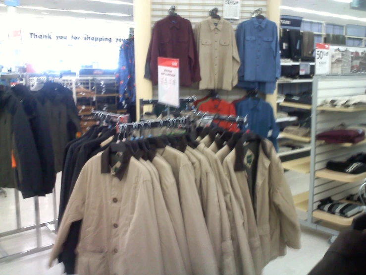 a display with a rack of shirts in a store