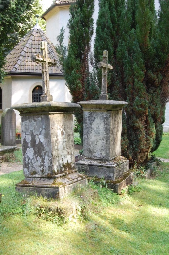 a cemetery with a crosses on one of it's graves