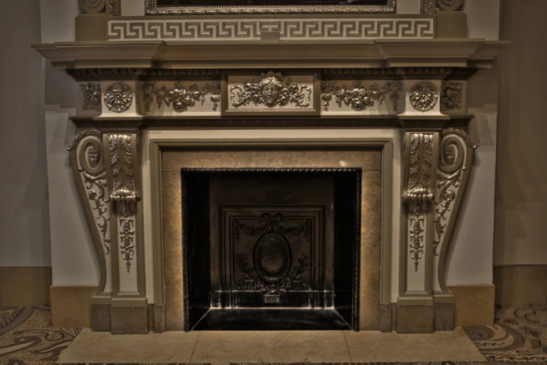 a fireplace decorated with art nouveau decoration