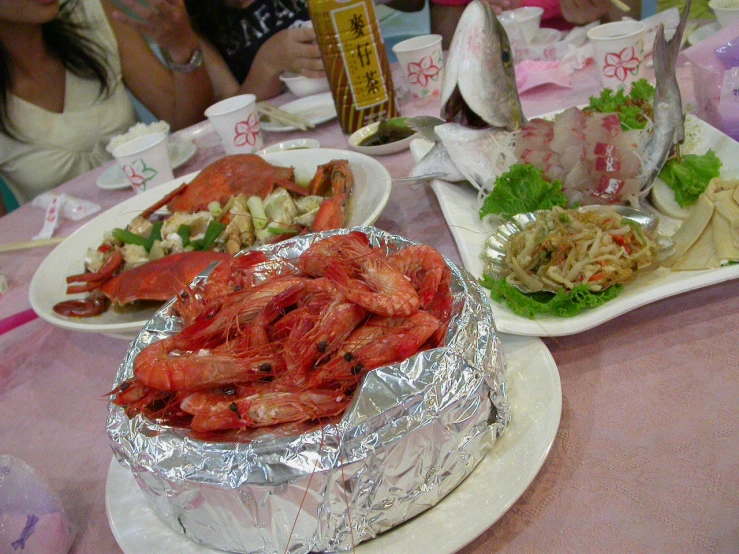 plates with large seafood and salad on them