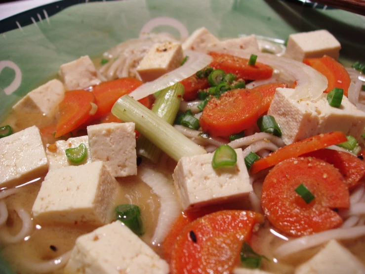 tofu and vegetables in a light green bowl