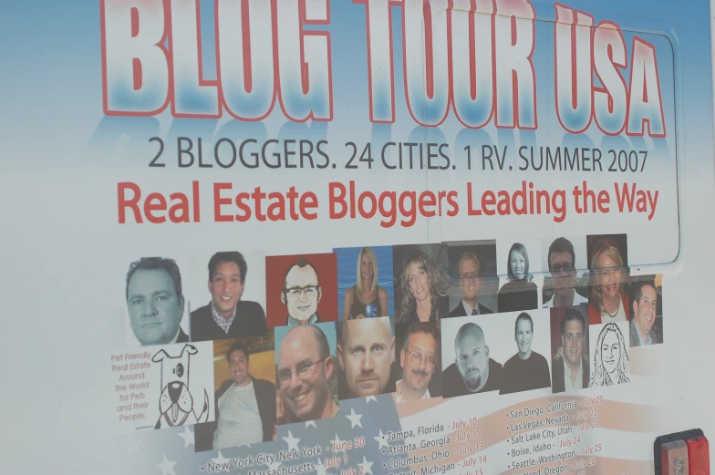 the sign on the building is telling people about real estate bloggers