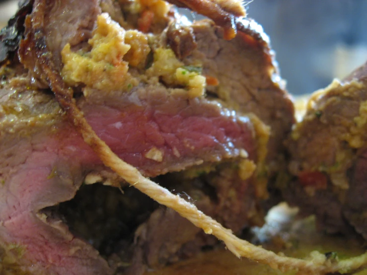 a close up view of meat covered with a nutritious topping