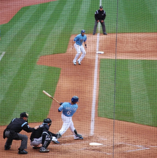 the view of a pitcher throwing a baseball during a baseball game