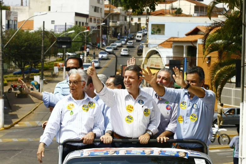 a large group of people riding in the back of a vehicle