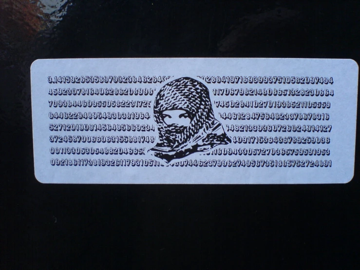 this is the front of a sticker with an image of a man in profile